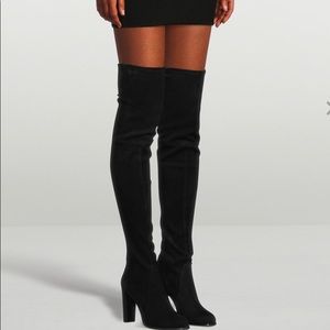 Stuart Weizmann over-the-knee boots.